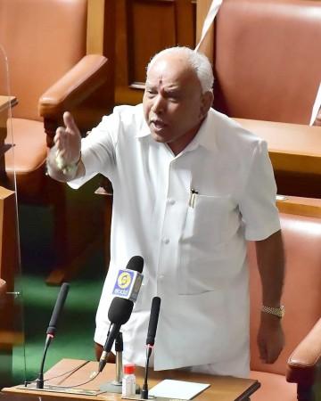 Bengaluru : Opposition party MLAs protesting during a budget session at Vidhana Soudha, in Bengaluru on Thursday 4th March 2021. Bengaluru : Opposition party MLAs protesting during a budget session at Vidhana Soudha, in Bengaluru on Thursday 4th March 2021.