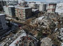 This aerial photo taken on Feb. 8, 2023 shows rescuers searching for survivors among the rubble of buildings destroyed in quake-hit Besni District of Adiyaman Province, Turkey.