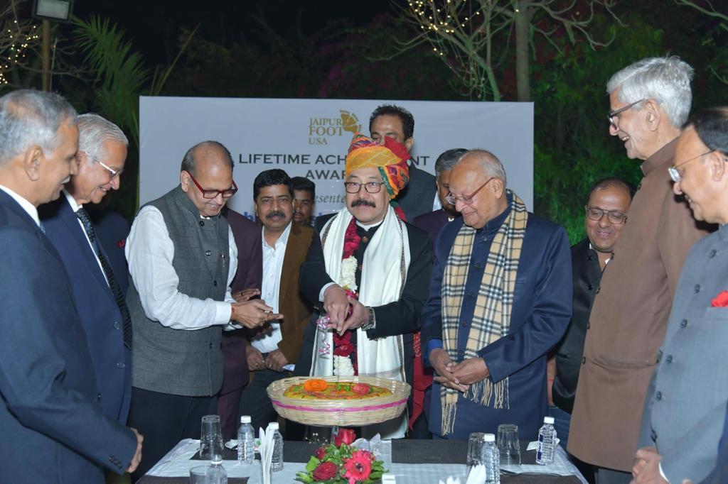 Harsh Vardhan Shringla gets lifetime achievement award for his outstanding contributions in Jodhpur by BMVSS. He celebrates by cutting a special peda cake.