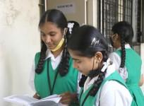 Students take last minute preparation before going to the SSLC examination Centre.