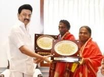 Stalin felicitates elephant whisperers Bomman and Bellie