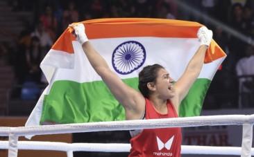 India's Saweety Boora celebrates her win over China's Wang Lina during the final match in 81 kg category at the 2023 IBA Women's Boxing World Championships in New Delhi
