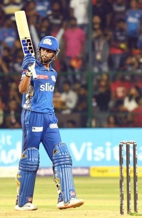 Bengaluru : MI's batter Tilak Varma celebrates his half-century during the IPL 2023 match between Royal Challengers Bangalore and Mumbai Indians, at Chinnaswamy Stadium in Bengaluru on Sunday, April 02, 2023. Tilak Varma