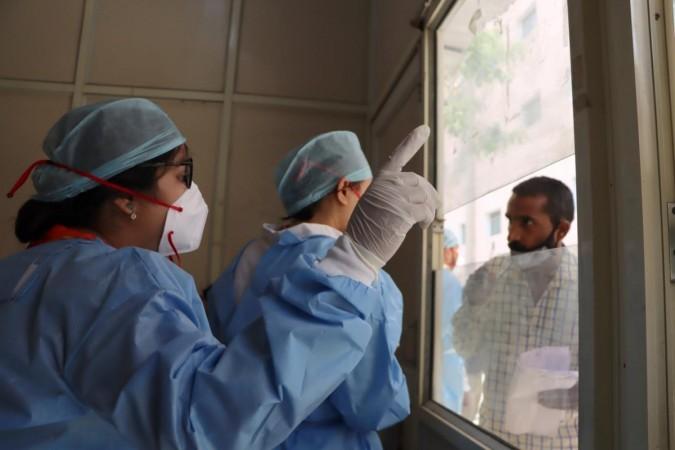 New Delhi: Health workers in PPE kits seen collecting swab samples for the COVID-19 testing amid a spike in Coronavirus cases, at RML Hospital in New Delhi on Monday, April 10, 2023. (Photo: Anupam Gautam/IANS) COVID-19