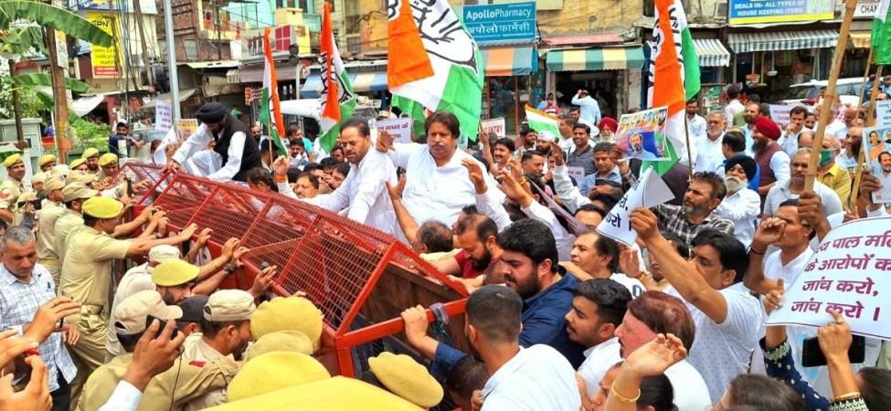 Congress workers protesting against BJP after startling revelations of ex-Governor of J&K Satya Pal Malik on Pulwama terror attack Congress