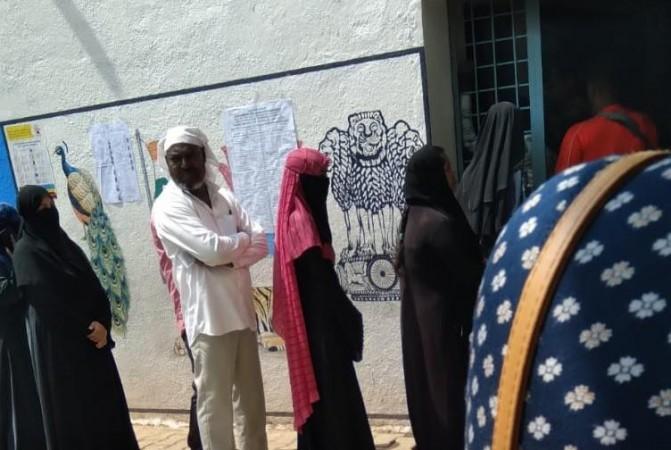 Queue seen for voting at a polling booth in government school in south Bengaluru on Wednesday around 10:45 AM / IBT Media Queue seen for voting at a polling booth