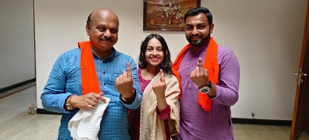 Karnataka CM Basavarj Bommai after casting his vote at Government Higher Primary school, Shiggaon along with his daughter Aditi and son Bharath. Basavarj Bommai