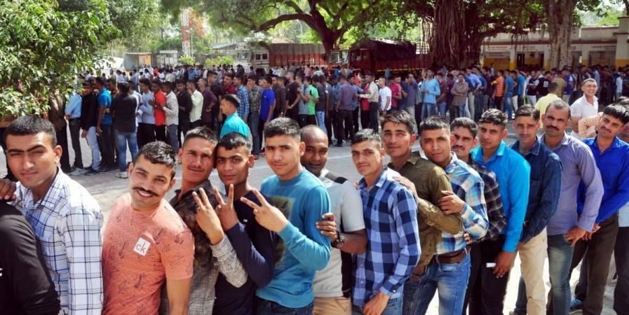 Lucknow: People queue-up to cast vote during the fifth phase of 2019 Lok Sabha elections at a polling booth in Lucknow on on May 6, 2019. (Photo: IANS) UP civic polls