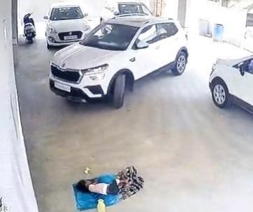 Car runs over toddler sleeping in Hyderabad parking lot. Car runs over toddler sleeping in Hyderabad parking lot