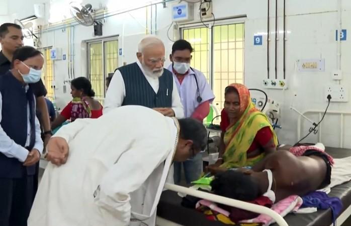 Balasore : Prime Minister Narendra Modi interacts with injured passengers of the Balasore train accident, in Balasore , Saturday, June 3, 2023. At least 261 people were killed and over 900 others suffered injuries in the accident that involved the Bengaluru-Howrah Superfast Express, the Shalimar-Chennai Central Coromandel Express, and a goods train. Prime Minister Narendra Modi interacts with injured passengers of the Balasore train accident, in Balasore , Saturday, June 3, 2023.