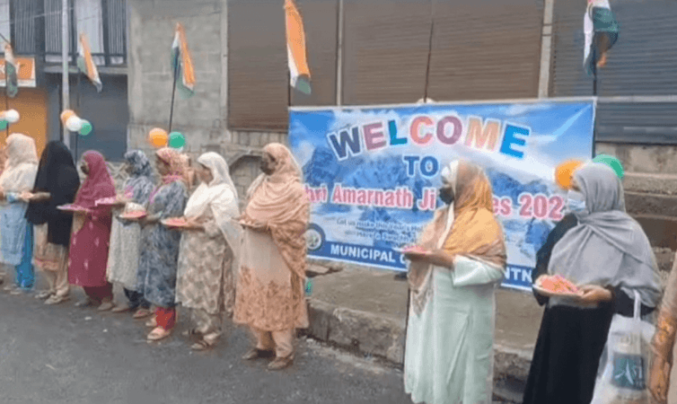 Local women of Kashmir Valley welcoming Amarnath pilgrims at Qazigund Amarnath Yatra