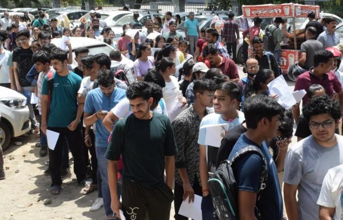 New Delhi: Students wait in a queue to appear in Common University Entrance Test (CUET), outside a centre in New Delhi on Sunday, May 21, 2023. (Photo: IANS/Wasim Sarvar) CUET UG