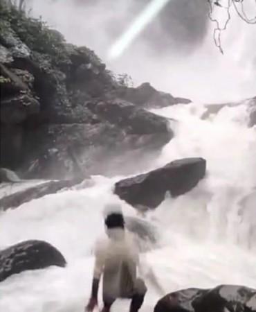 Youth watching Karnataka waterfall slips from rock into water, search underway In a tragic incident, a young man watching a waterfall in Karnataka's Udupi district, while slipped into the river from the rock he was standing on and went missing on Monday, police said.