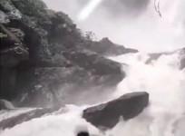 In a tragic incident, a young man watching a waterfall in Karnataka's Udupi district, while slipped into the river from the rock he was standing on and went missing on Monday, police said.
