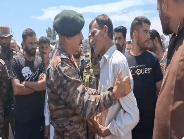Army officer consoling the father of Rifleman Waseem Sarwar during the last rites of the soldier who sacrificed his life during the line of duty. Father of Waseem Sarwar