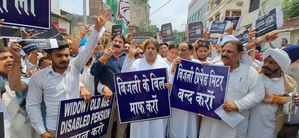 Congress leaders protesting against installation of smart electricity meters in Jammu and Kashmir Cong media cell Congress protest