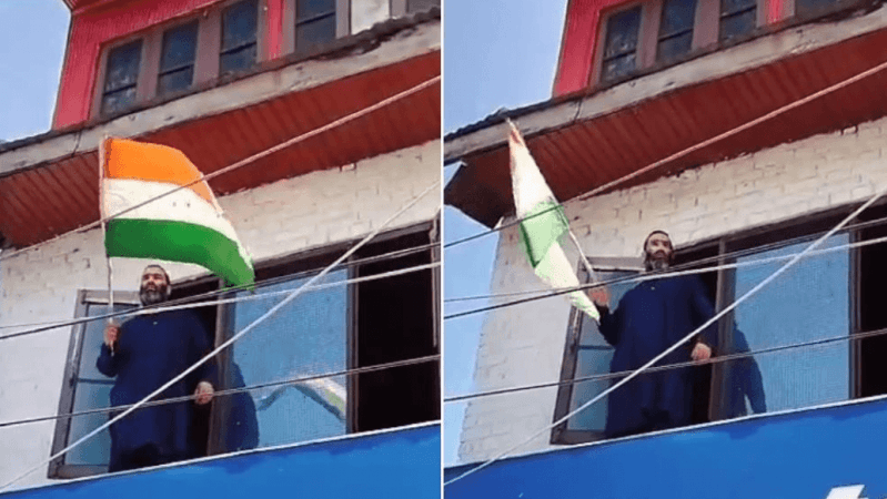Rayees Ahmad, the brother of the Lashkar-e-Toiba terrorist Javed Ahmad raising a national flag at his house in Sopore . Terrorist brother
