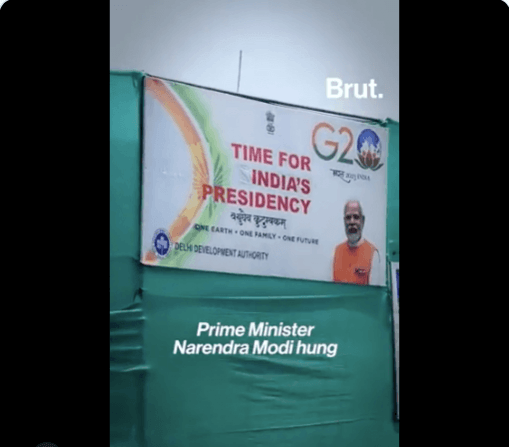 Screens covering slum areas in the Capital G20