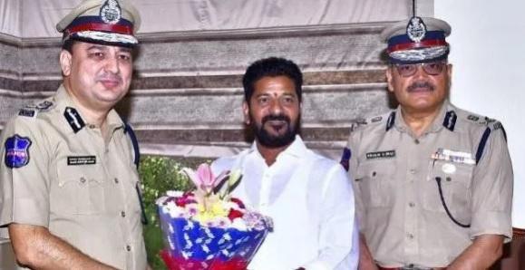 Anjani Kumar (right) seen with A. Revanth Reddy while counting was still underway Anjani Kumar (right)