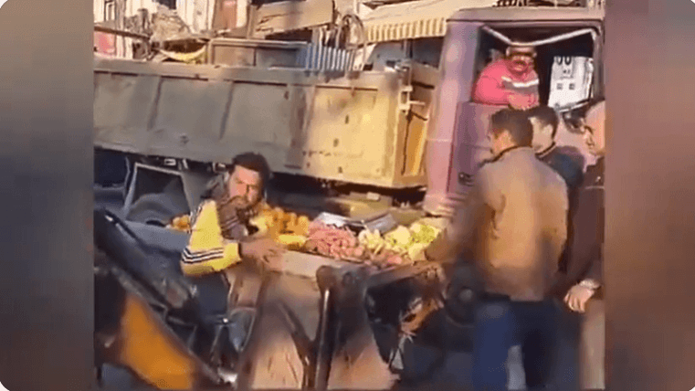 Vendor Sunny Kumar trying to save his cart from the wrath of the officials of the Kathua Municipal Council Kathua vendor