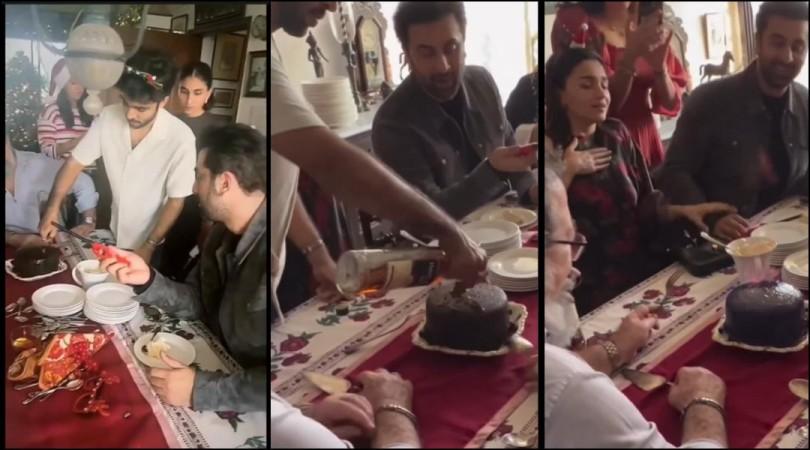 Ranbir Kapoor in black lighting a chirstmas cake. Alioa Bhatt siting next to him; reacts. 'Jai mata di': Ranbir Kapoor reacts after lighting spirit-doused Christmas cake; Alia Bhatt reacts