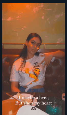 Nysa wears a T-shirt that read, Nysa wears a T-shirt that read,