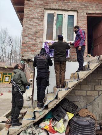 Cops attaching property of an Over Ground Worker in Budgam district of J&K Property attached