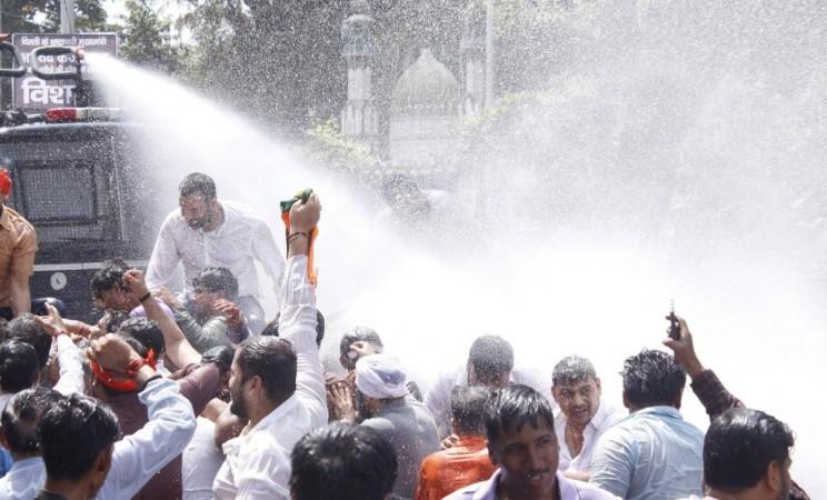Water cannon used on BJP workers seeking Delhi CM Kejriwal's resignation Water cannon used on BJP workers seeking Delhi CM Kejriwal's resignation