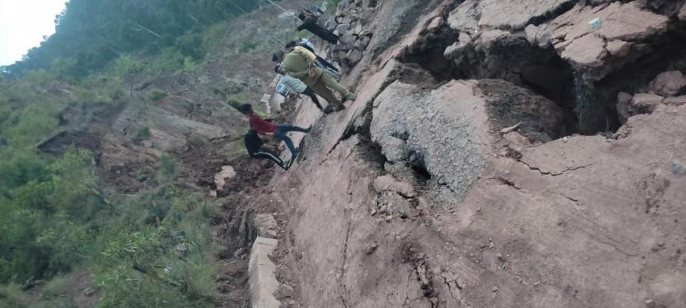 A view of road badly affected due to sinking of land in Ramban district of J&K Sinking village