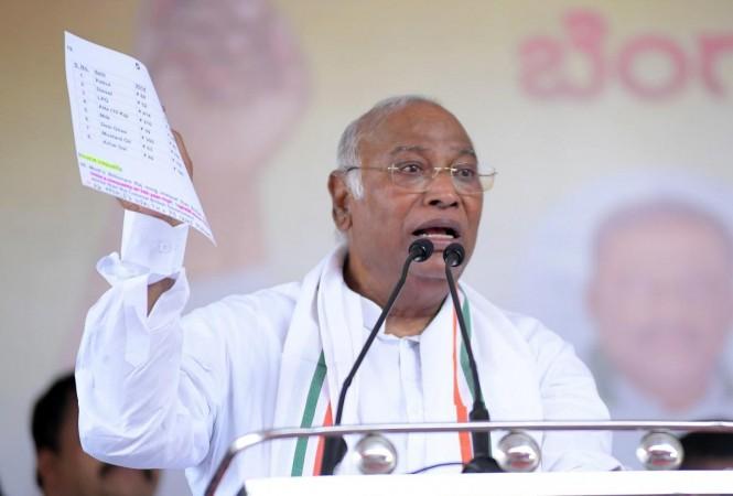 Channapatna: AICC President Mallikarjun Kharge addresses during a public meeting in support of party candidate D.K. Suresh for Lok Sabha elections, in Channapatna, Monday, April 22, 2024.(IANS) AICC President Mallikarjun Kharge