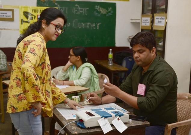 Meerut: A polling official administering indelible ink to a voter, at a polling booth, during the 2nd Phase of General Elections-2024 at Ucch Prathmik Vidyalaya, Meerut, in Uttar Pradesh on April 26, 2024.(IANS/PIB) Meerut polling