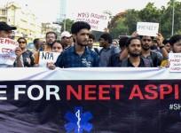 Candidates and students take out a protest march against the alleged irregularities in the NEET exam and the National Testing Agency (NTA)