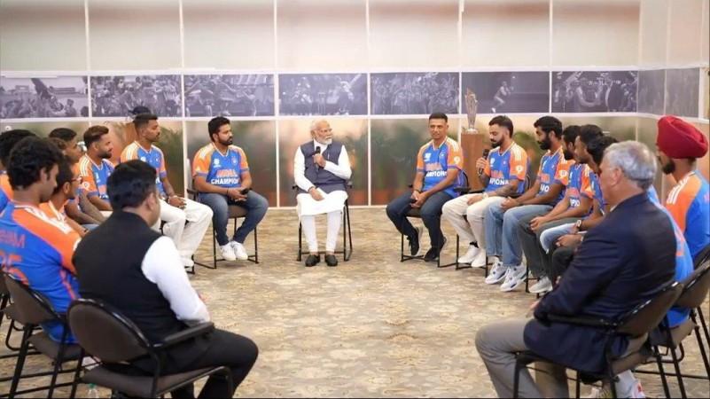 PM Narendra Modi beams with joy as he holds WC trophy with captain Rohit Sharma; poses with team India at his residence [Pics]