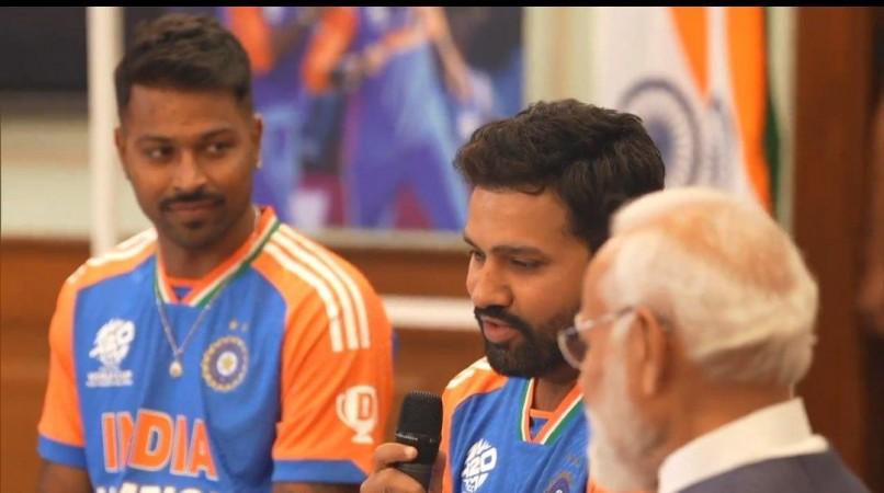 PM Narendra Modi beams with joy as he holds WC trophy with captain Rohit Sharma; poses with team India at his residence [Pics]