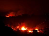 Wildfires rage across US; prompt evacuations, highway shutdown
