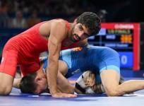 India's Aman Sehrawat and North Macedonia's Vladimir Egorov compete in the round of 16 of the men's freestyle 57kg wrestling match