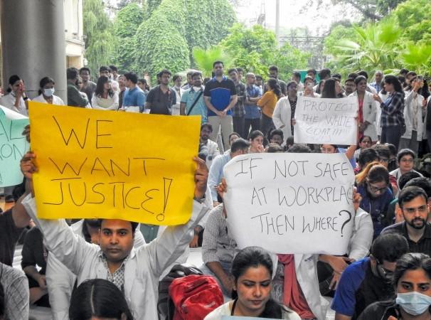 FORDA (Federation of Resident Doctors Association) members holding posters stage a protest demanding justice for the woman PG trainee doctor found raped and murdered at RG Kar Medical College in Kolkata FORDA (Federation of Resident Doctors Association) members holding posters stage a protest demanding justice for the woman PG trainee doctor found raped and murdered at RG Kar Medical College in Kolkata