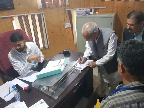 One of the founder members of PDP Abdul Rehman Veeri filing his nomination papers. Abdul Rehman Veeri