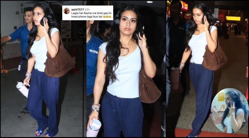 Nysa Devgn in casuals walking outside the airport. She is talking on her phone. Fans noticed that she is wearing headphones and commented the same. Nysa Devgn in casuals walking outside the airport. She is talking on her phone. Fans noticed that she is wearing headphones and commented the same.
