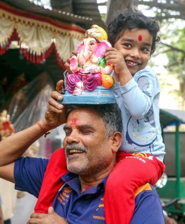 Bengaluru: People shop for Gowri and Ganesha idols on the eve of the Ganesh Chaturthi festival Bengaluru: People shop for Gowri and Ganesha idols on the eve of the Ganesh Chaturthi festival
