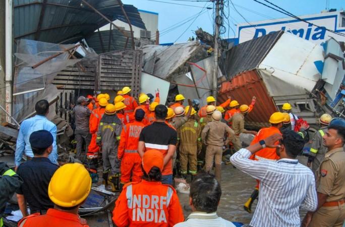 NDRF and Police personnel conduct a rescue operation after a 3-storey building collapsed NDRF and Police personnel conduct a rescue operation after a 3-storey building collapsed