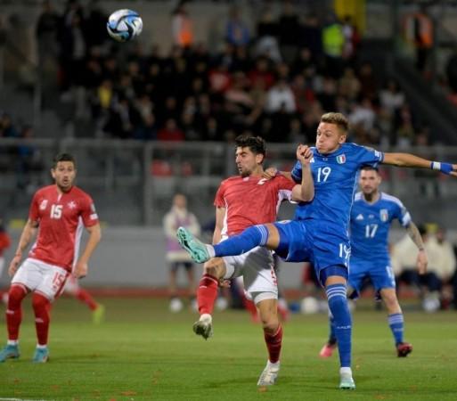 Malta's Cain Attard (front L) vies with Italy's Mateo Retegui during the 2024 UEFA European Championship Title : Italy,Malta,Euro qualifier