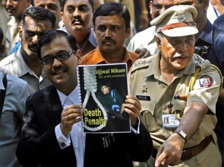 Special Prosecuter Ujjwal Nikam holds up a document, with a cover showing Mohammad Ajmal Kasab, at Arthur Road Jail, where Kasab's trial was held, in Mumbai May 6, 2010. An Indian court on Thursday sentenced to death Kasab over the 2008 Mumbai attacks that killed 166 people. The death penalty which in India is carried out by hanging, must be confirmed by higher court. Special Prosecuter Ujjwal Nikam holds up a document, with a cover showing Mohammad Ajmal Kasab, at Arthur Road Jail, where Kasab's trial was held, in Mumbai May 6, 2010