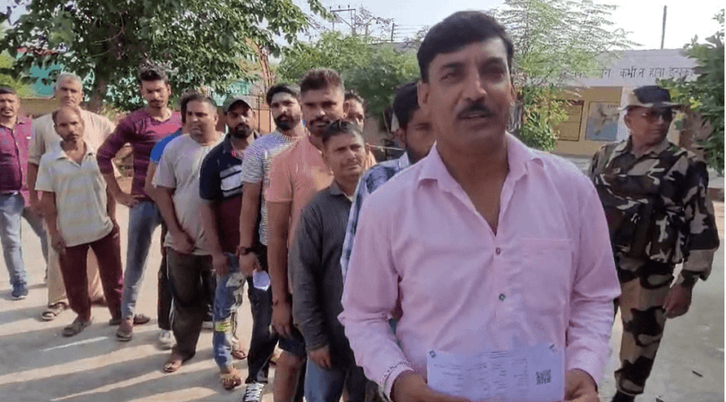 A group of West Pakistan Refugees standing in a queue in Govt middle school Nihalpur in Kathua district to cast their votes. West Pak Refugees