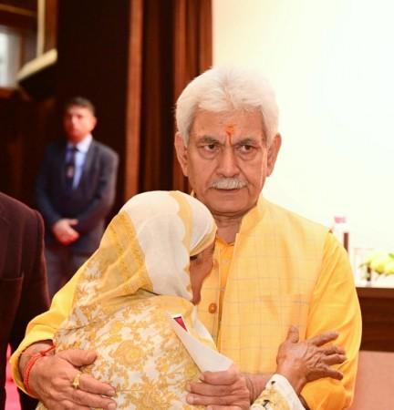 LG Manoj Sinha consoling a terror victim women LG Manoj Sinha