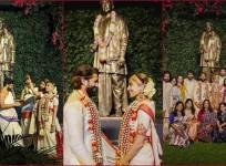 Newlyweds Naga Chaitanya and Sobhita Dhulipala lovingly gaze into each other's eyes as they pose in front of ANR statue