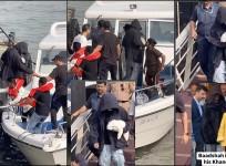 Injured? : Shah Rukh Khan bumps his head on jetty ceiling while shielding his face in oversized hoodie while holding his cute dog