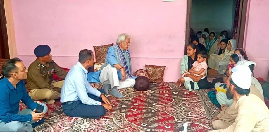 Lieutenant Governor of J&K Manoj Sinha with family of Tariq Ahmed LG Manoj Sinha