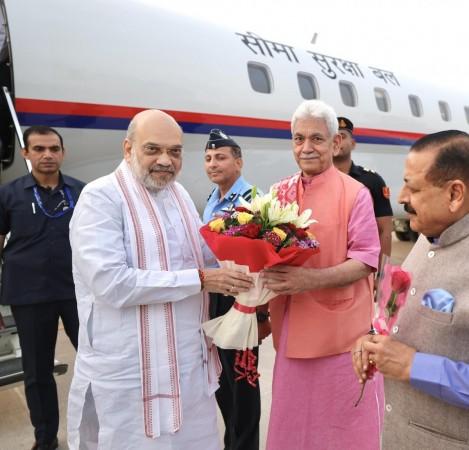 Lieutenant Governor of J&K Manoj Sinha receiving Union Home Minister Amit Shah at Jammu airport on Sunday Amit Shah