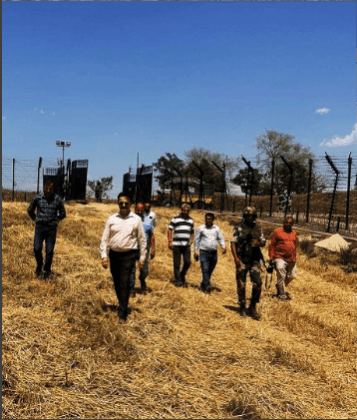 Officers visiting villages situated on the International Border across the fence to ensure harvesting of crops as early as possible Harvesting